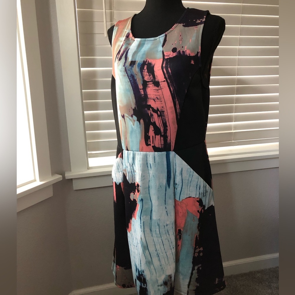 Multi color geometric jumper or dress. Most I size L. Sleeveless with two pocket